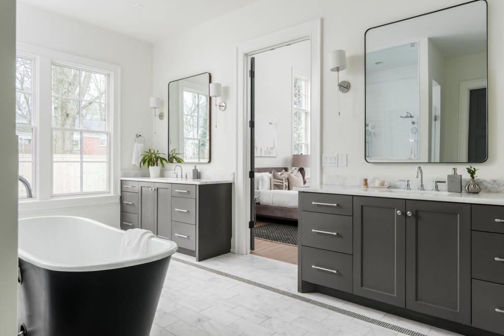 Design ideas for a large transitional master bathroom in Nashville with shaker cabinets, brown cabinets, a freestanding tub, a double shower, a one-piece toilet, white walls, marble floors, an undermount sink, marble benchtops, white floor, an open shower, white benchtops, an enclosed toilet, a double vanity and a built-in vanity.