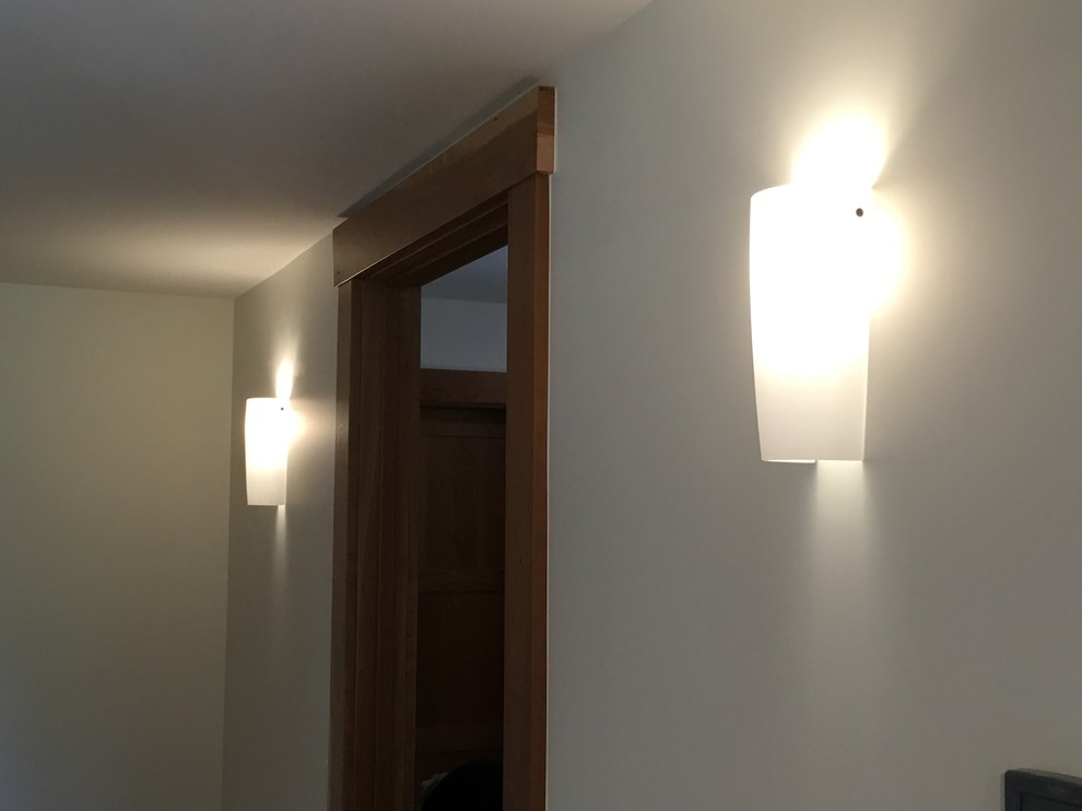 Transitional home design photo in Denver with white walls