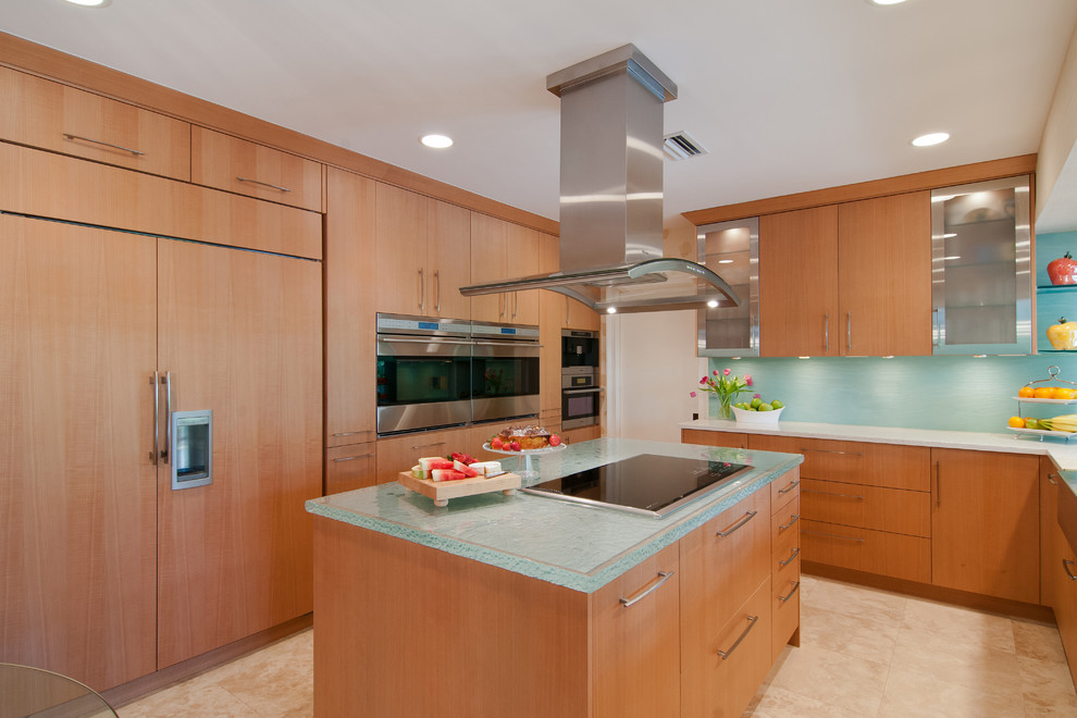 Design ideas for a contemporary kitchen in Miami with flat-panel cabinets, glass benchtops, medium wood cabinets, panelled appliances and turquoise benchtop.