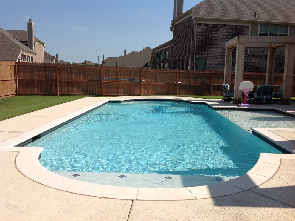 Inspiration for a large transitional backyard rectangular pool remodel in Dallas