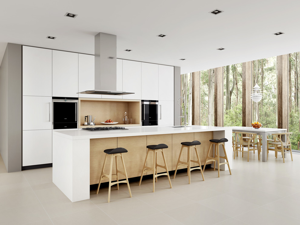 This is an example of a mid-sized scandinavian galley eat-in kitchen in Sydney with a drop-in sink, white cabinets, quartz benchtops, stainless steel appliances, porcelain floors and with island.