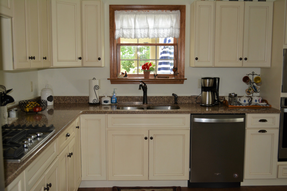 Eat-in kitchen - small transitional l-shaped medium tone wood floor and brown floor eat-in kitchen idea with an undermount sink, flat-panel cabinets, beige cabinets, quartz countertops, stainless steel appliances, an island and brown countertops