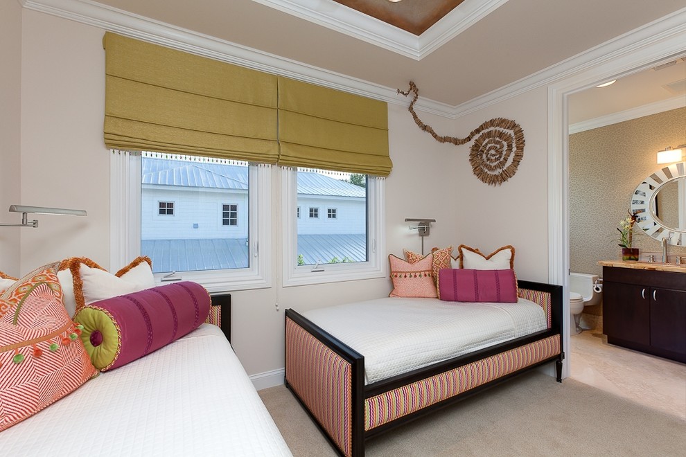 This is an example of a contemporary guest bedroom in Miami with beige walls and carpet.