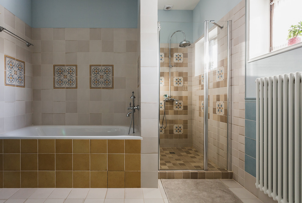 Inspiration for a mid-sized traditional 3/4 bathroom in Moscow with recessed-panel cabinets, light wood cabinets, an undermount tub, a shower/bathtub combo, a wall-mount toilet, multi-coloured tile, porcelain tile, multi-coloured walls, porcelain floors, a vessel sink, beige floor, a hinged shower door, white benchtops, a niche, a single vanity, a freestanding vanity and recessed.
