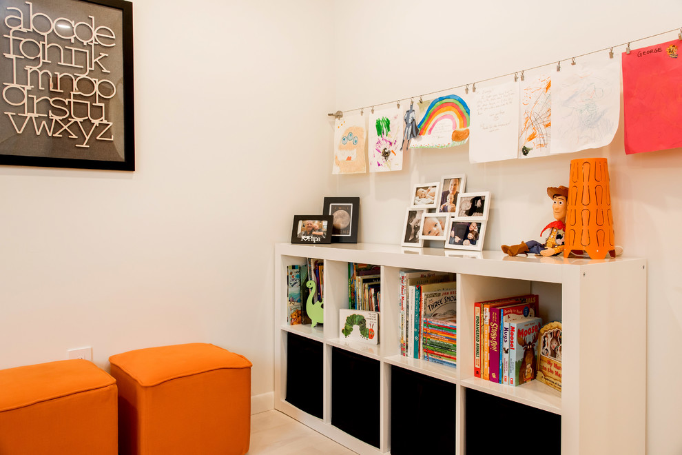 Mid-sized midcentury kids' bedroom in Other with white walls and light hardwood floors for kids 4-10 years old and boys.