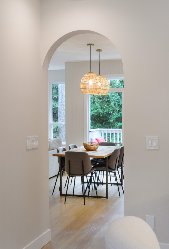 Small trendy vinyl floor and brown floor hallway photo in Vancouver with brown walls