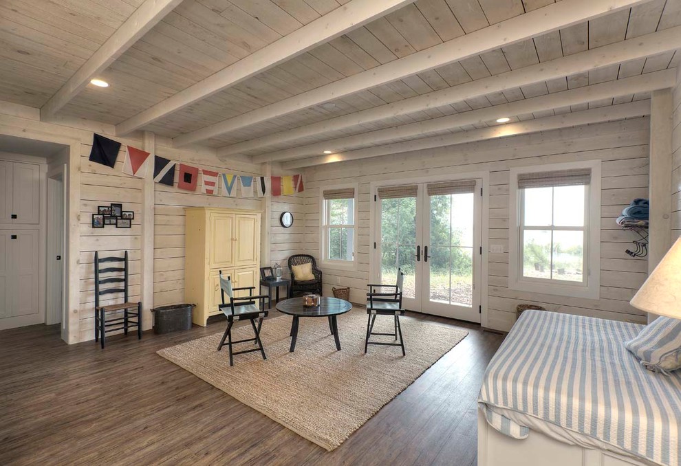 Beach style kids' bedroom in Other with white walls and dark hardwood floors.