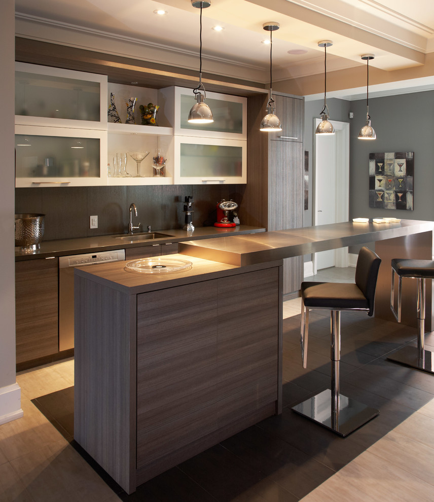 Inspiration for a contemporary galley seated home bar in Toronto with medium hardwood floors, an undermount sink, flat-panel cabinets, grey splashback, medium wood cabinets and ceramic splashback.