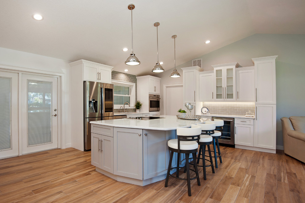 This is an example of a large modern galley eat-in kitchen in Tampa with with island.