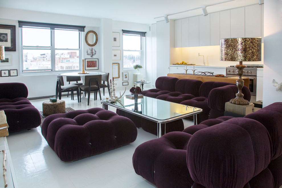 This is an example of a contemporary open concept living room in New York with white walls and white floor.