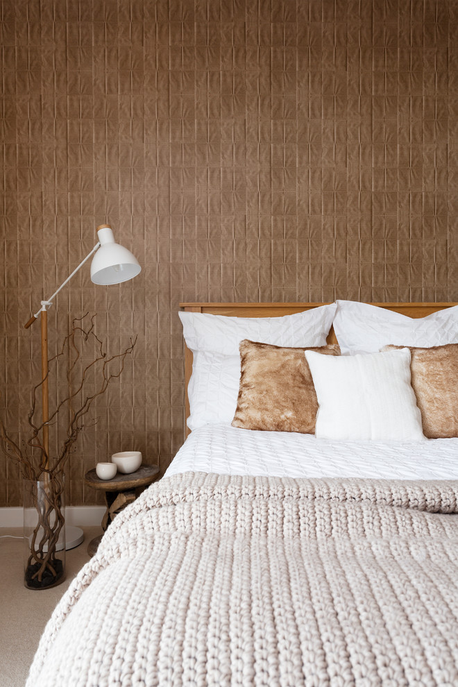 Photo of a contemporary bedroom in London with beige walls, carpet and beige floor.