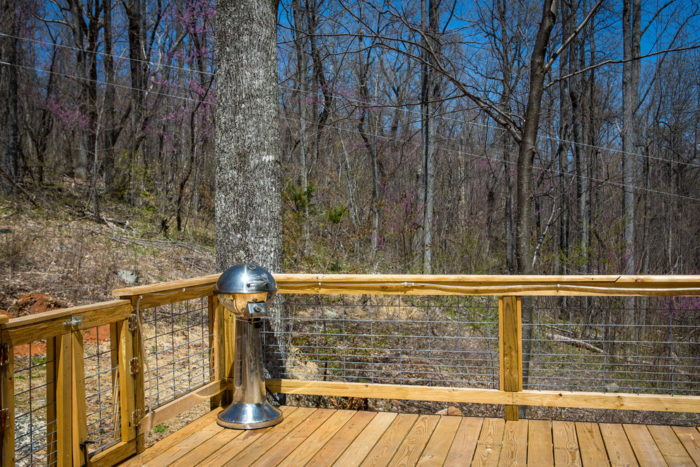 This is an example of a small eclectic backyard deck in Other with an outdoor kitchen and no cover.