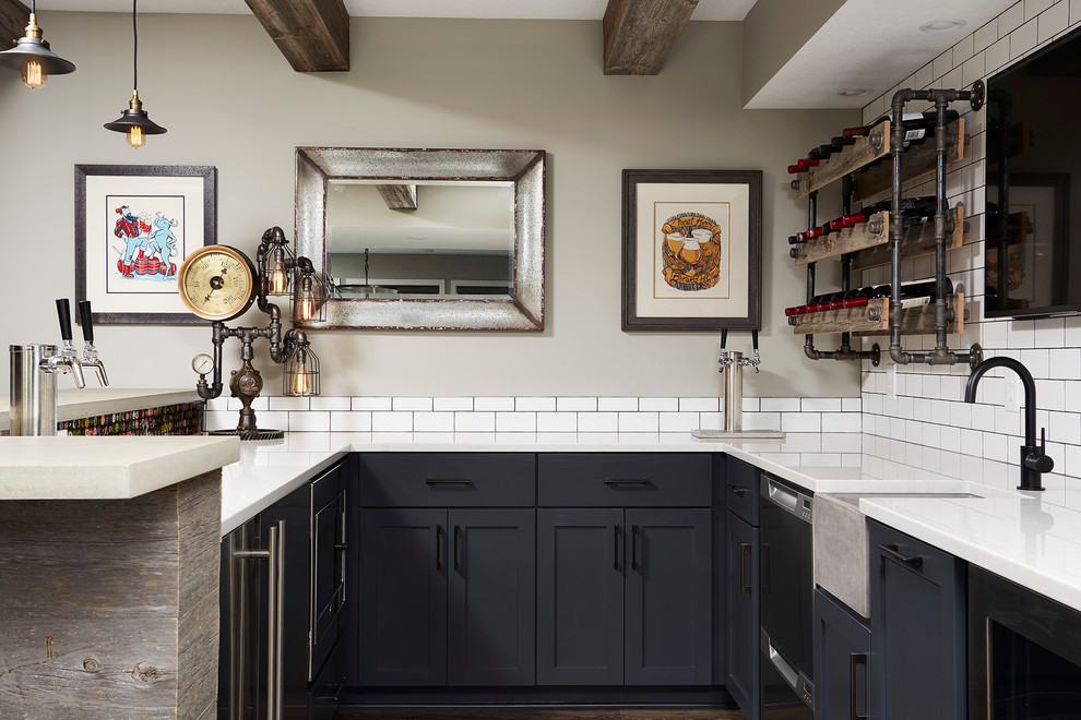 Inspiration for a mid-sized transitional u-shaped wet bar in Minneapolis with an undermount sink, grey cabinets, concrete benchtops, white splashback, subway tile splashback, dark hardwood floors and shaker cabinets.