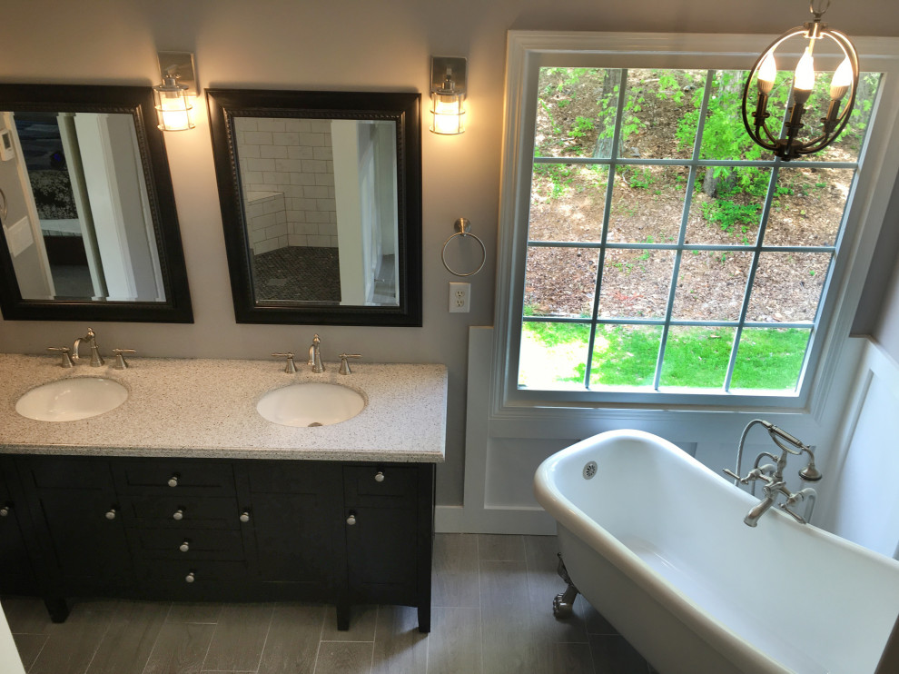 Large arts and crafts master bathroom in Atlanta with shaker cabinets, black cabinets, a claw-foot tub, an alcove shower, black and white tile, cement tile, grey walls, cement tiles, an undermount sink, marble benchtops, grey floor, a hinged shower door and white benchtops.