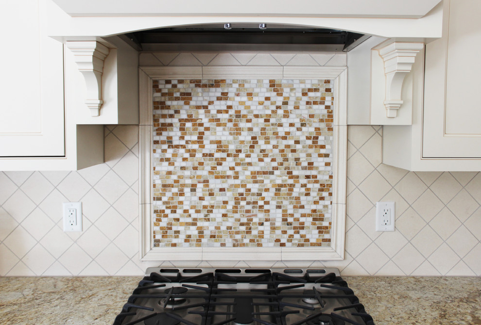 Kitchen - mid-sized transitional kitchen idea in Cedar Rapids with recessed-panel cabinets, white cabinets, granite countertops, multicolored backsplash, mosaic tile backsplash and stainless steel appliances