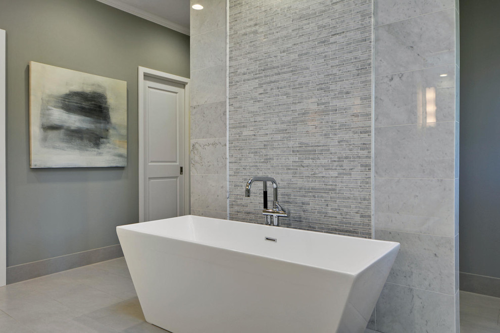 Freestanding bathtub - large transitional master gray tile and stone tile porcelain tile freestanding bathtub idea in Austin with shaker cabinets, white cabinets, a one-piece toilet, gray walls, quartzite countertops and an undermount sink