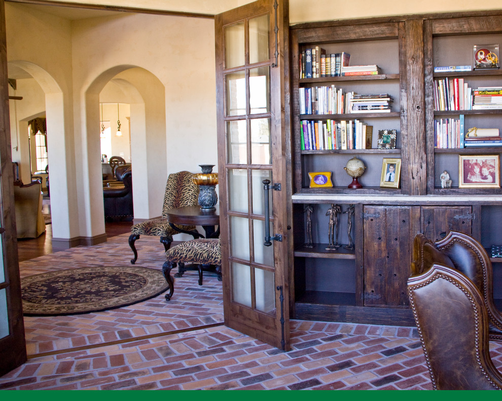 This is an example of a mediterranean study room in Austin with a built-in desk.