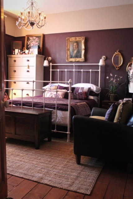 Inspiration for a large traditional master bedroom in Wiltshire with purple walls, dark hardwood floors, a standard fireplace and a metal fireplace surround.
