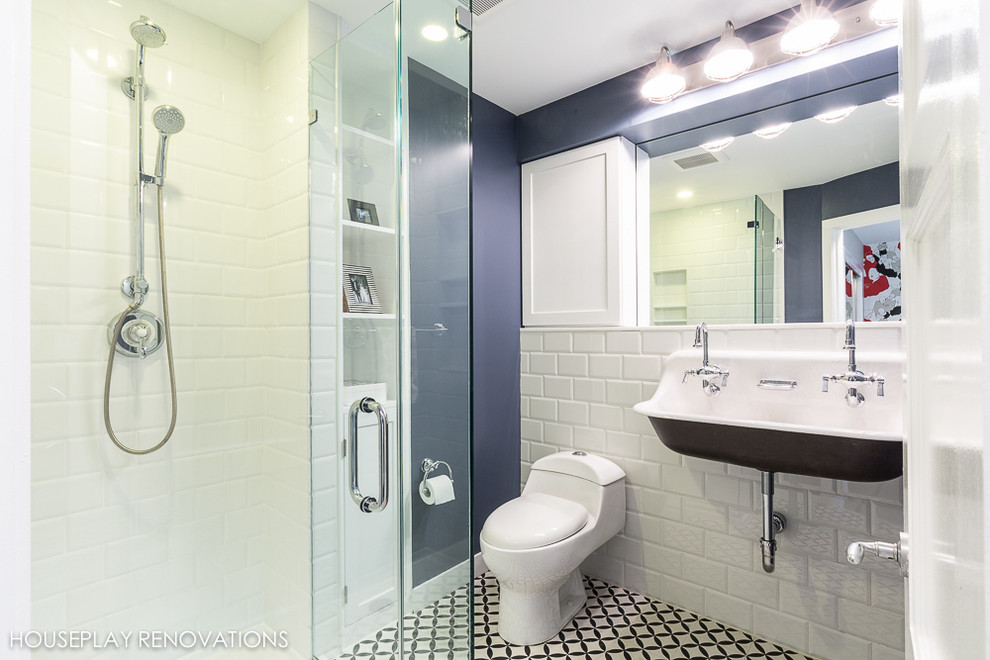 Photo of a mid-sized modern master bathroom in New York with a wall-mount sink, a corner shower, white tile, subway tile and mosaic tile floors.