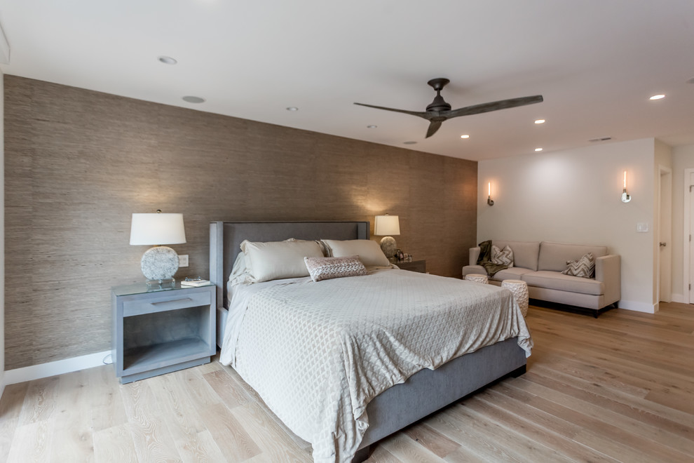 This is an example of a large contemporary master bedroom in San Francisco with white walls, medium hardwood floors and white floor.