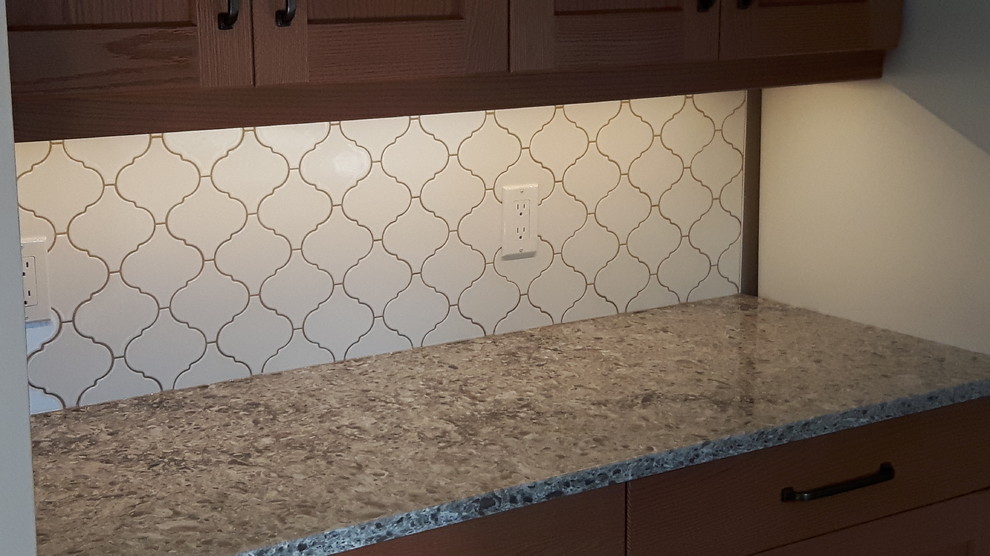 Inspiration for a mid-sized timeless kitchen remodel with shaker cabinets, light wood cabinets, granite countertops, white backsplash and porcelain backsplash