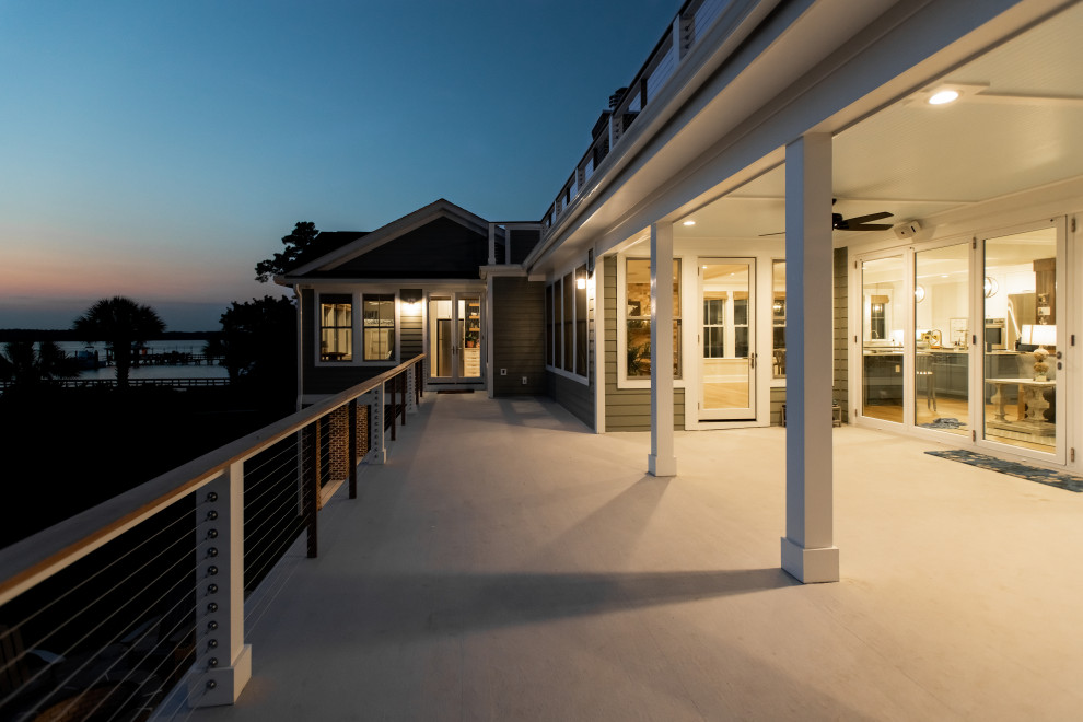 Large transitional backyard second story mixed material railing deck photo in Charleston with no cover