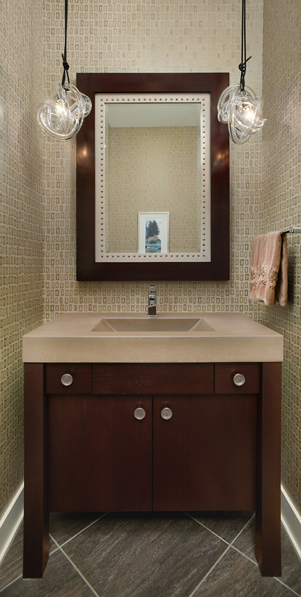 Small transitional 3/4 bathroom in Grand Rapids with an integrated sink, dark wood cabinets, concrete benchtops, a one-piece toilet, beige walls and slate floors.