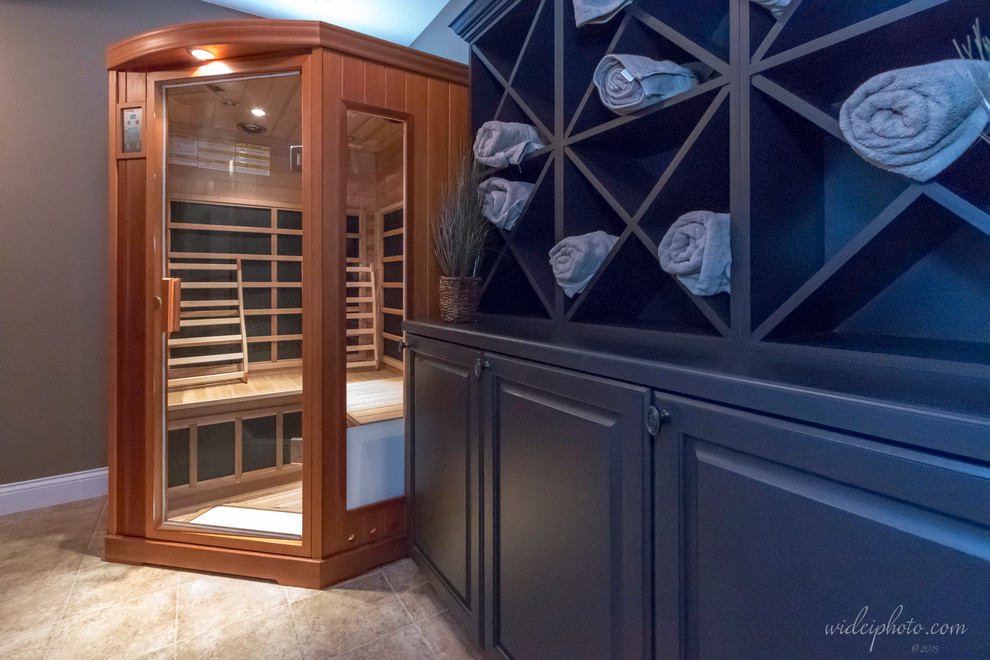 Inspiration for a large modern wine cellar in St Louis with ceramic flooring.