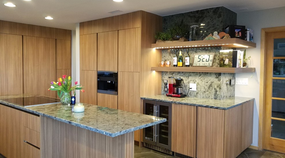 Inspiration for a mid-sized contemporary u-shaped eat-in kitchen with a double-bowl sink, medium wood cabinets, granite benchtops, green splashback, stone slab splashback, stainless steel appliances, porcelain floors, with island, grey floor and green benchtop.