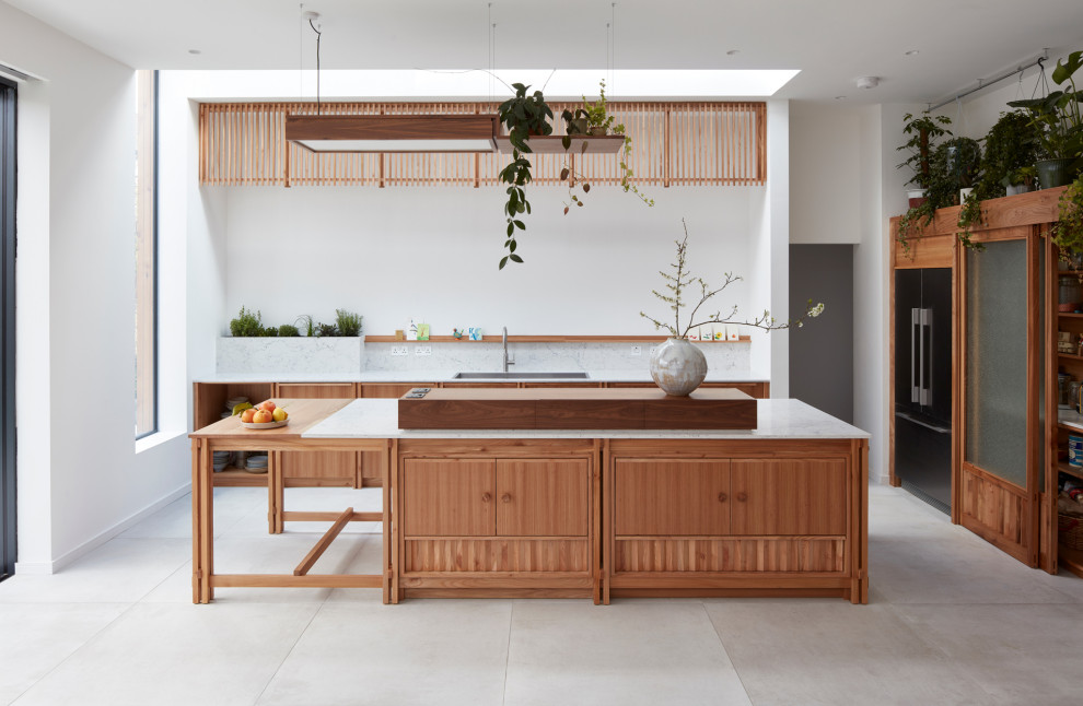 Inspiration for a large scandinavian grey and white l-shaped open plan kitchen in Other with a double-bowl sink, flat-panel cabinets, medium wood cabinets, quartz worktops, white splashback, engineered quartz splashback, stainless steel appliances, porcelain flooring, an island, grey floors, white worktops and a feature wall.