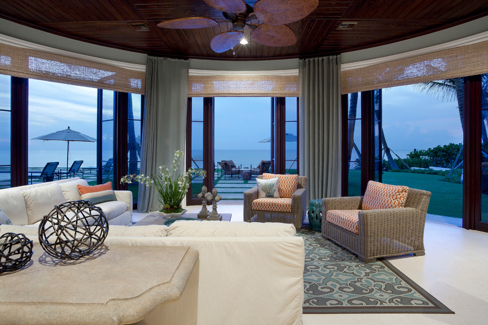 Design ideas for a tropical formal open concept living room in Miami.
