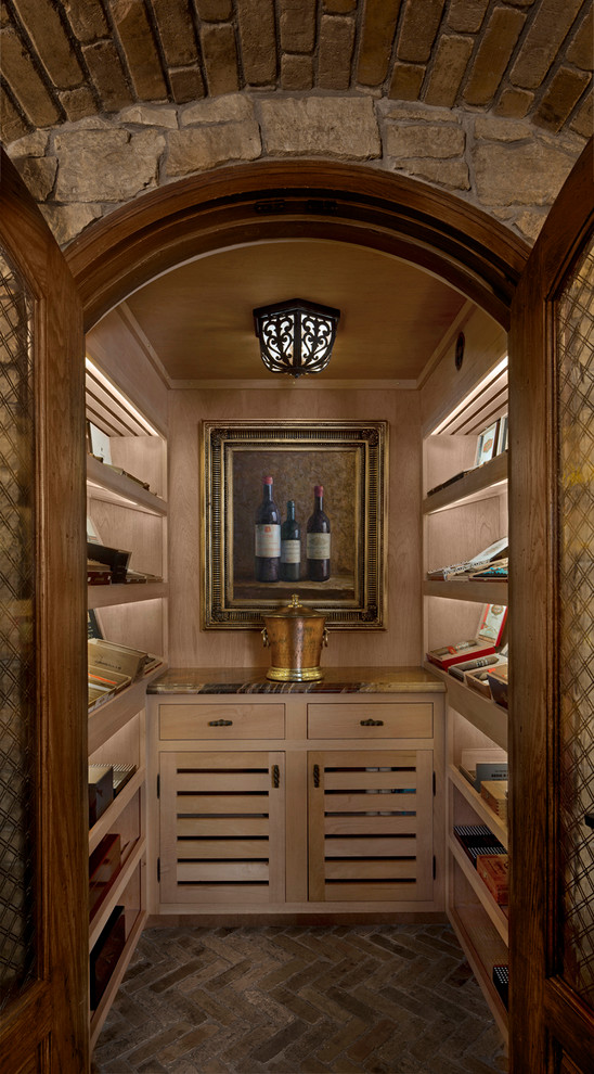 Design ideas for a mid-sized traditional galley home bar in Detroit with no sink, light wood cabinets, marble benchtops, brick floors, beige floor and open cabinets.