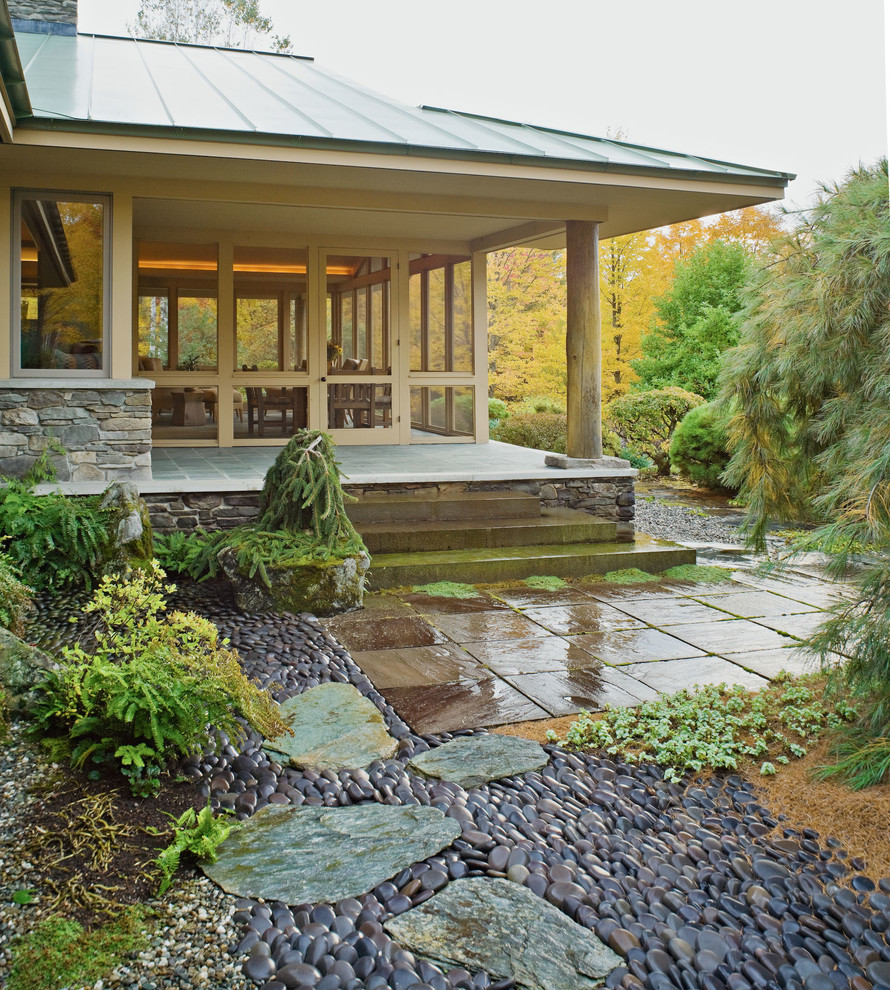 Asian backyard garden in Burlington with natural stone pavers for fall.