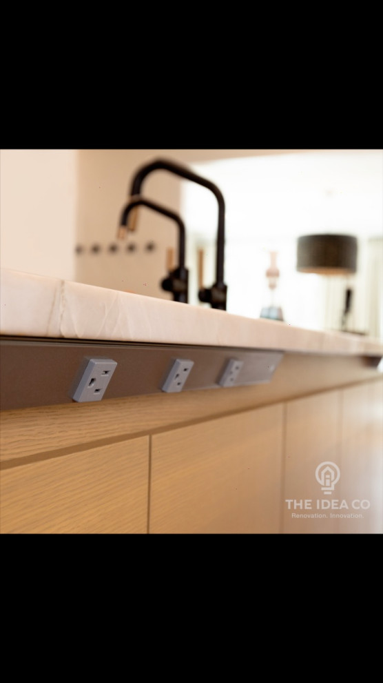 Inspiration for a mid-sized transitional galley light wood floor and brown floor kitchen pantry remodel with a single-bowl sink, recessed-panel cabinets, white cabinets, quartzite countertops, multicolored backsplash, ceramic backsplash, stainless steel appliances, an island and white countertops