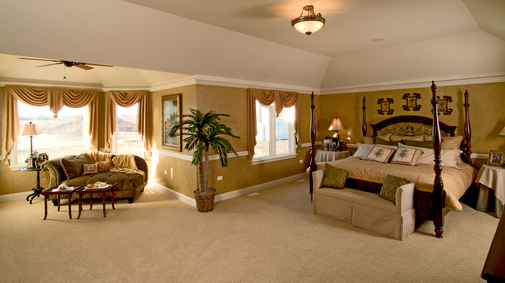 Photo of a large traditional master bedroom in Chicago with beige walls, carpet and no fireplace.