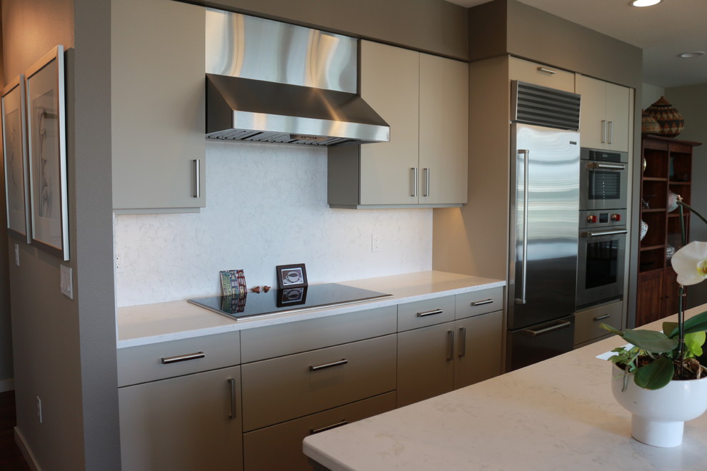 Inspiration for a mid-sized transitional galley eat-in kitchen in Seattle with an undermount sink, flat-panel cabinets, beige cabinets, quartz benchtops, multi-coloured splashback, stone slab splashback, stainless steel appliances, with island and multi-coloured benchtop.