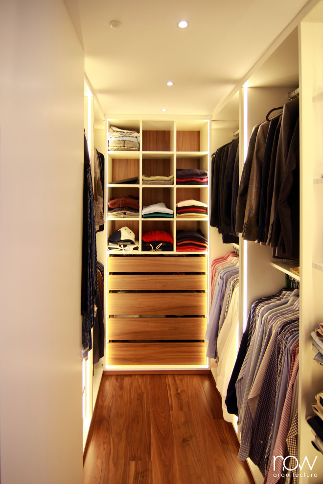 Mid-sized transitional men's dark wood floor dressing room photo in Other with open cabinets