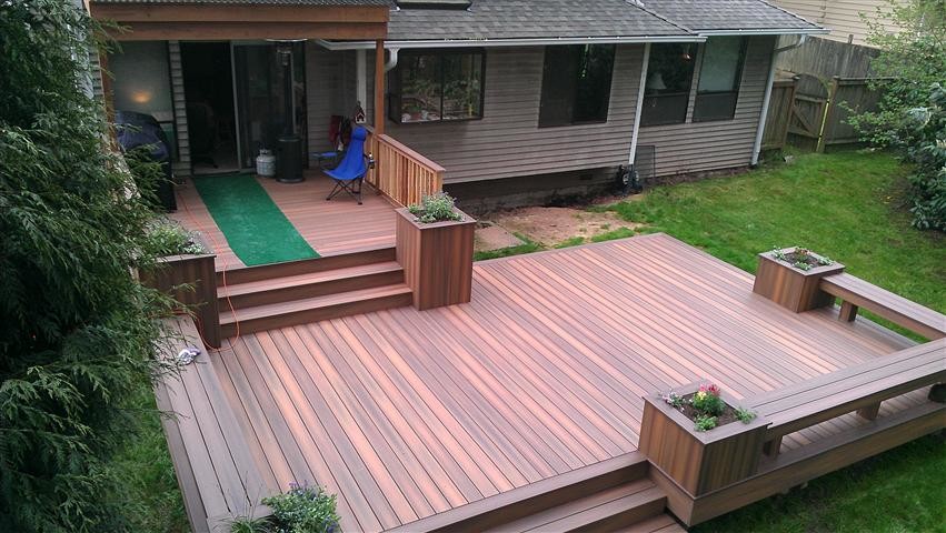 Inspiration for a contemporary patio in Charlotte with decking and no cover.