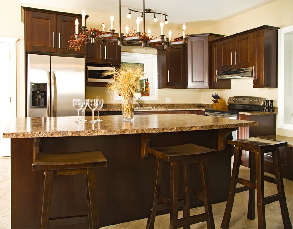 Inspiration for a transitional ceramic tile kitchen remodel in Toronto with shaker cabinets, medium tone wood cabinets, granite countertops, stainless steel appliances and an island