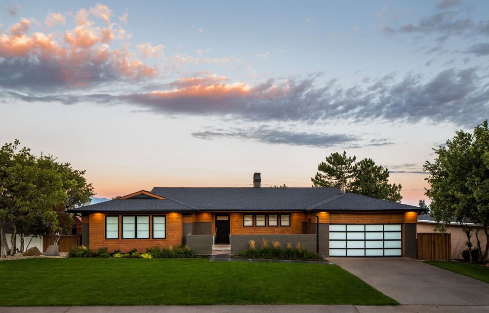 Midcentury one-storey brown house exterior in Salt Lake City with mixed siding, a hip roof and a shingle roof.