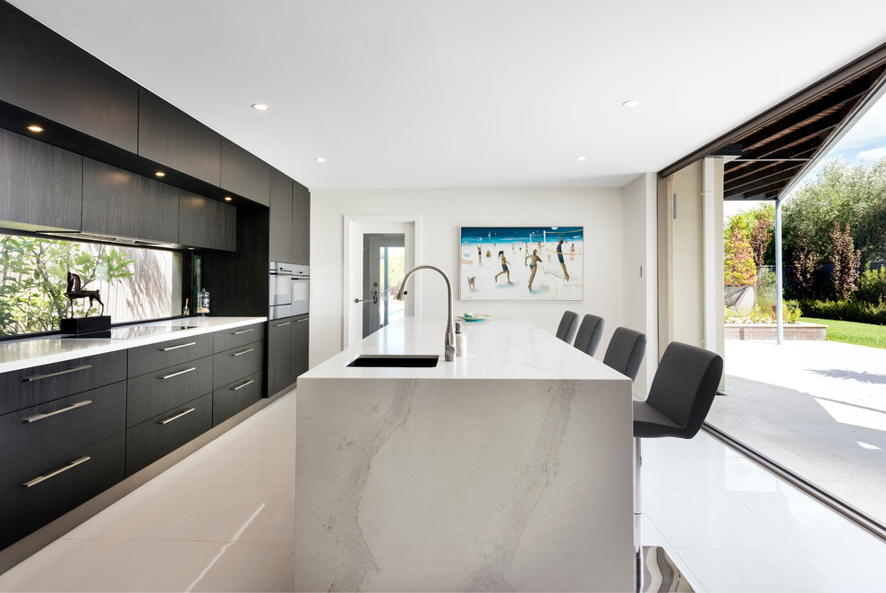 Contemporary single-wall kitchen in Perth with an undermount sink, flat-panel cabinets, dark wood cabinets and with island.