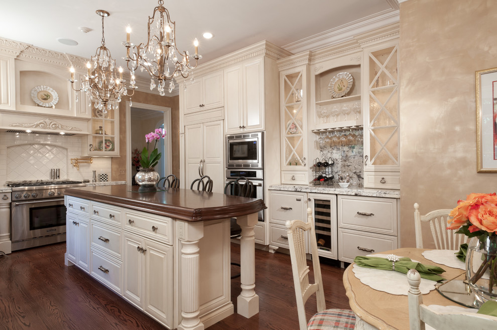 This is an example of a traditional eat-in kitchen in St Louis with stainless steel appliances.