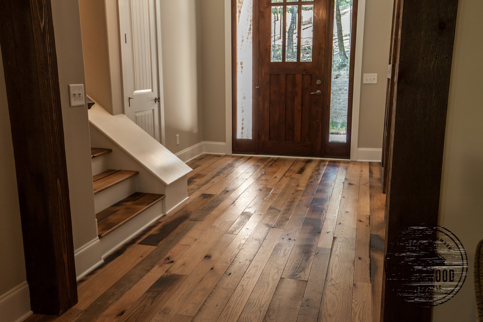 Country entryway in Nashville with medium hardwood floors.