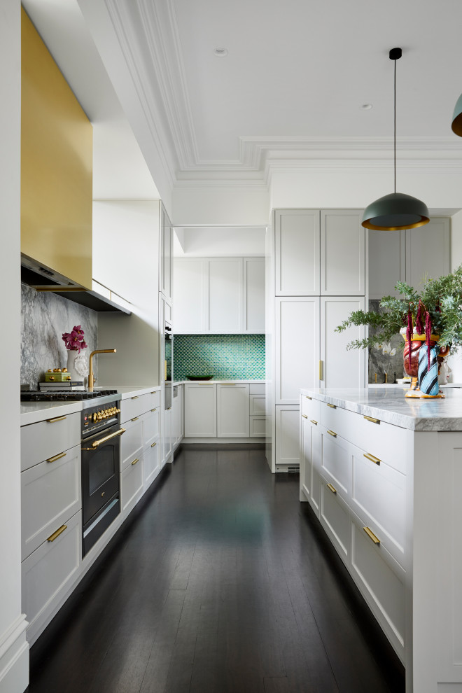 Photo of a mid-sized contemporary open plan kitchen in Melbourne with a double-bowl sink, white cabinets, marble benchtops, multi-coloured splashback, marble splashback, black appliances, dark hardwood floors, with island, brown floor and white benchtop.
