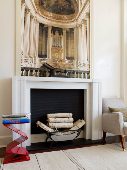 Inspiration for a mid-sized traditional enclosed living room in New York with white walls and a standard fireplace.