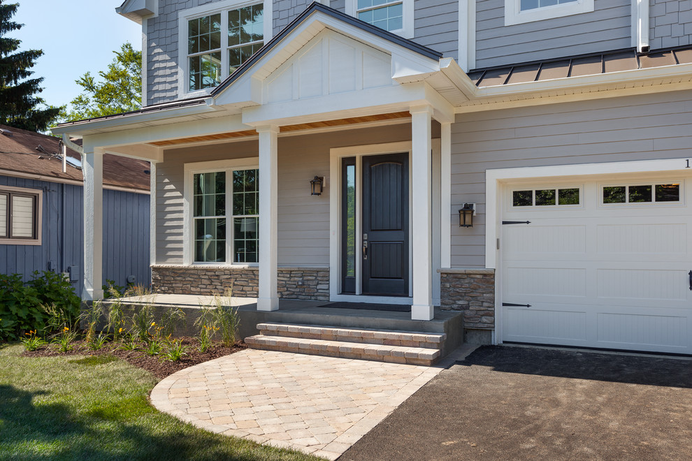 Inspiration for a transitional front door remodel in Chicago with a black front door