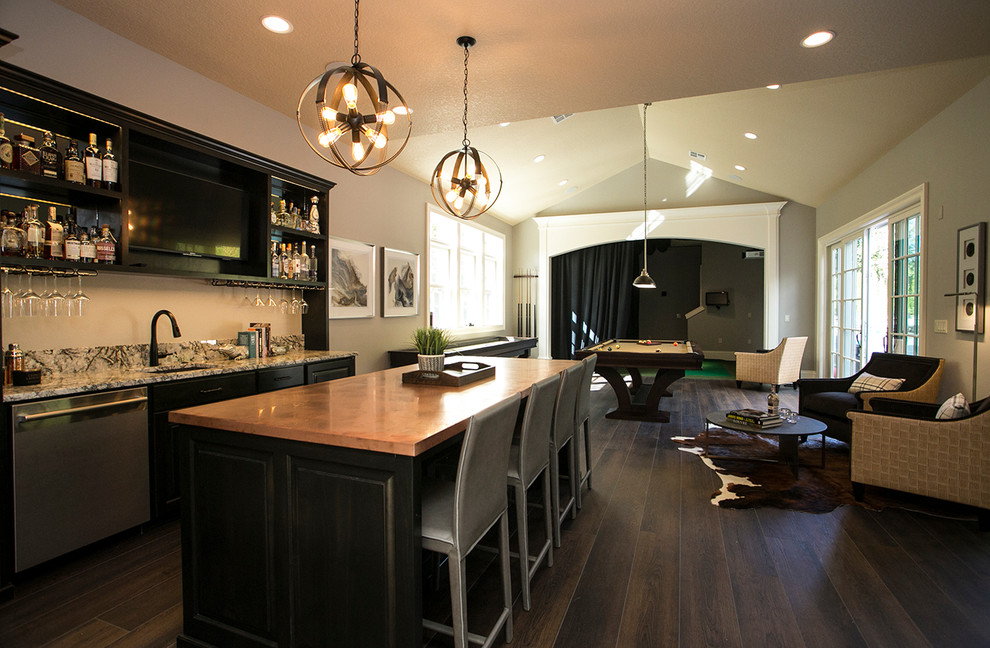 This is an example of a large transitional seated home bar in Portland with an undermount sink, raised-panel cabinets, copper benchtops and porcelain floors.