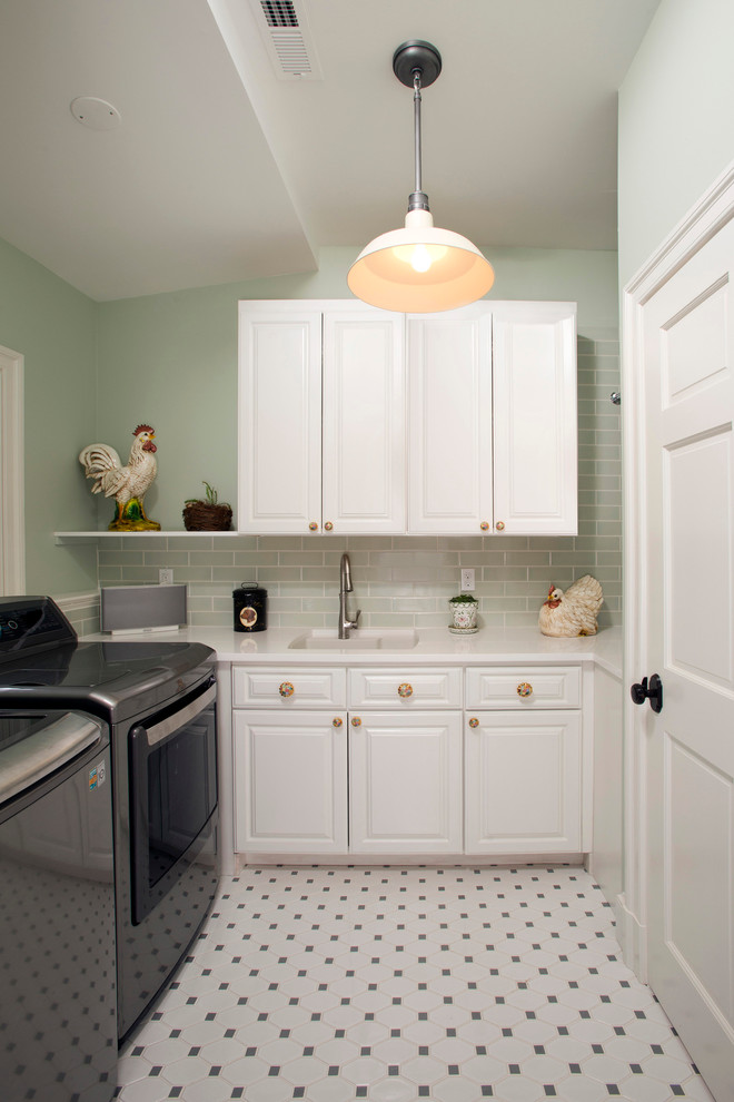 Inspiration for a large transitional laundry room in DC Metro with beige walls and dark hardwood floors.