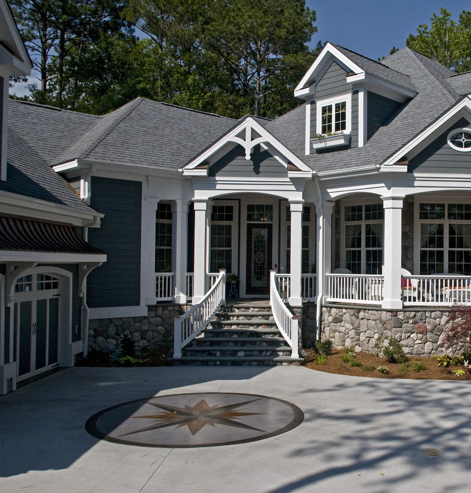 This is an example of a traditional two-storey grey exterior in Raleigh.