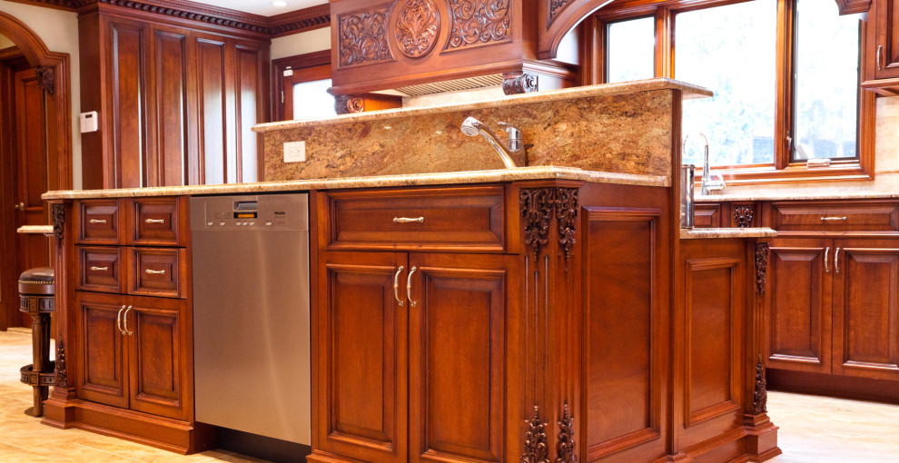 This is an example of a large traditional u-shaped eat-in kitchen in New York with an integrated sink, shaker cabinets, brown cabinets, quartz benchtops, beige splashback, engineered quartz splashback, stainless steel appliances, with island, beige floor, brown benchtop and coffered.